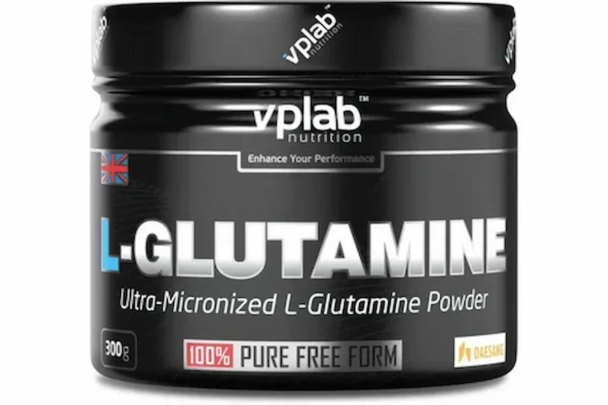 A black container of VPLab Nutrition L-Glutamine powder with a silver lid. The label highlights that it is ultra-micronized, weighs 300 grams, is 100% pure free form, and bears a British flag indicating origin.